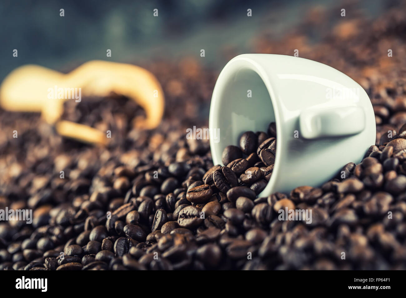 Coffee. Coffee beans. Coffee cup full of coffee beans. Toned image. Stock Photo