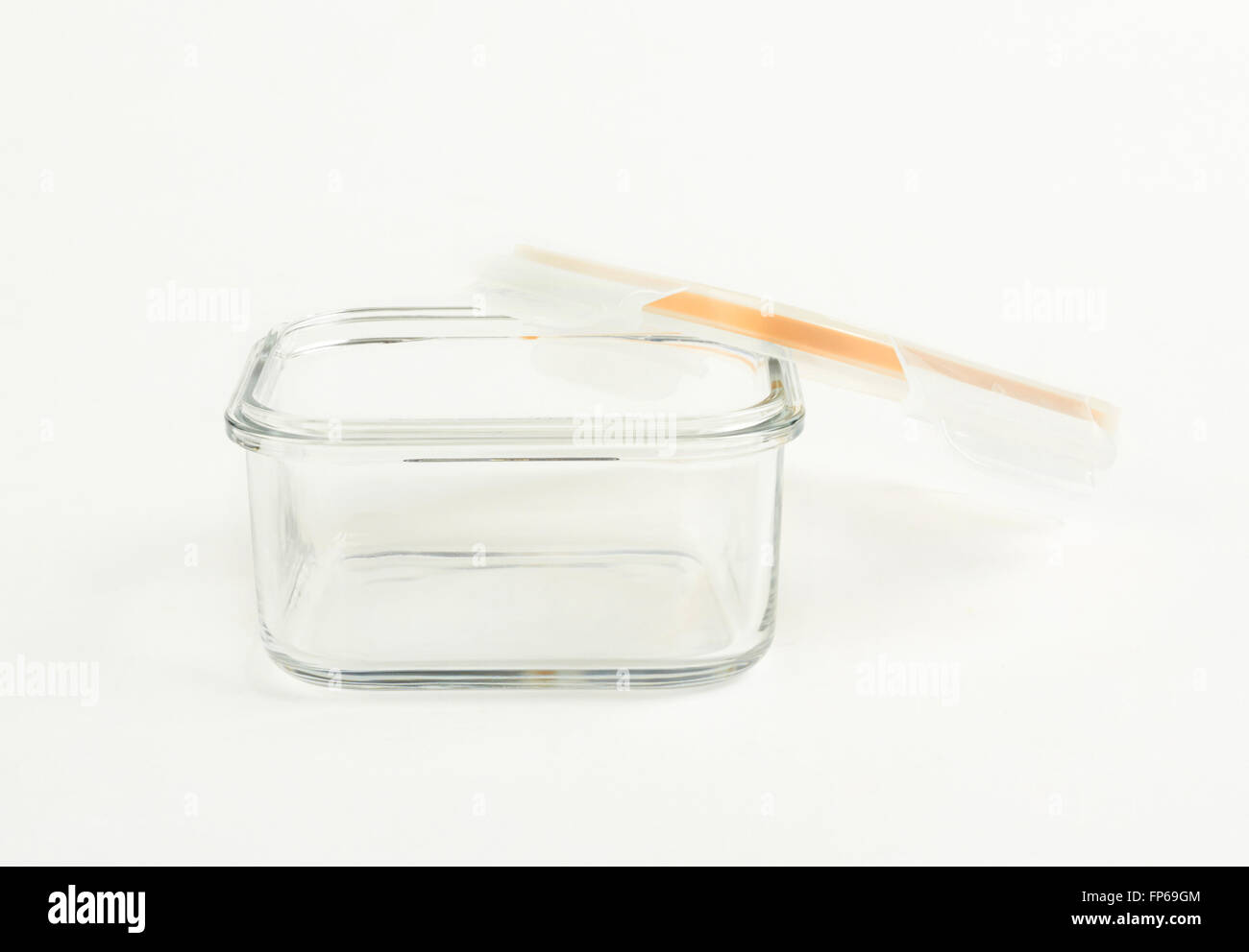 Glass food container with plastic lid on white background Stock Photo