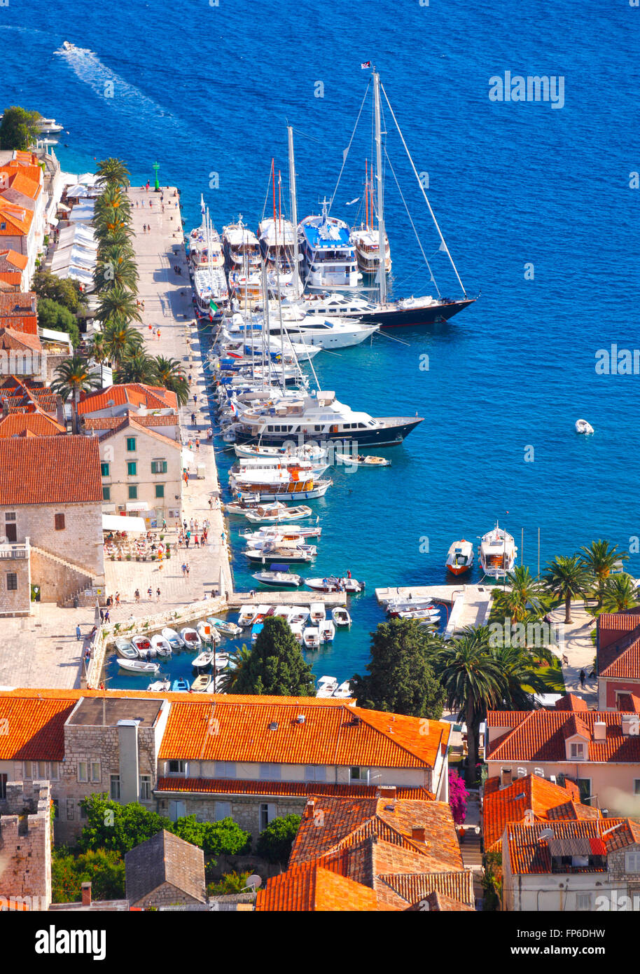 Marina with yachts and promenade in old town Hvar Stock Photo