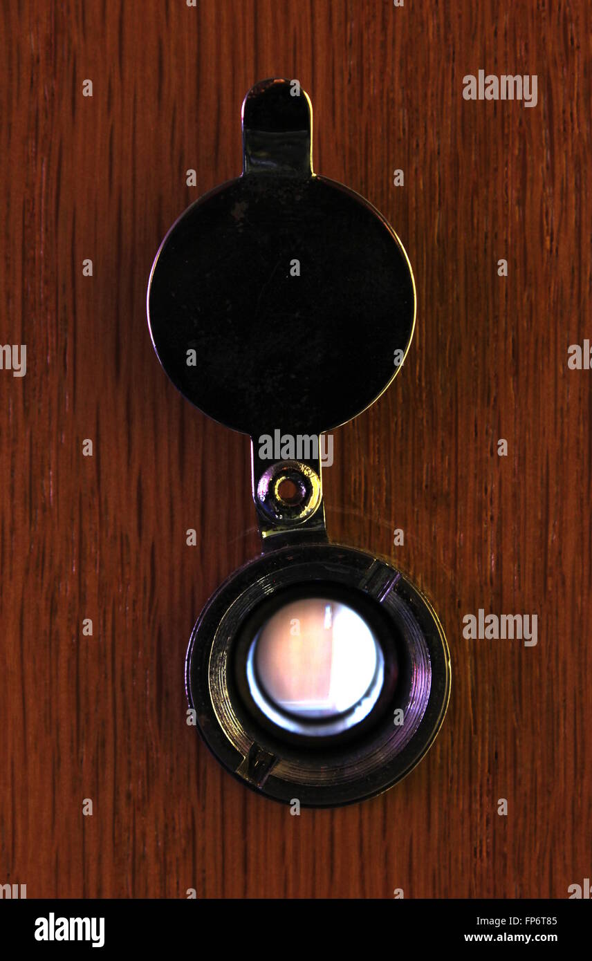 Looking through a door viewer at another door Stock Photo Alamy