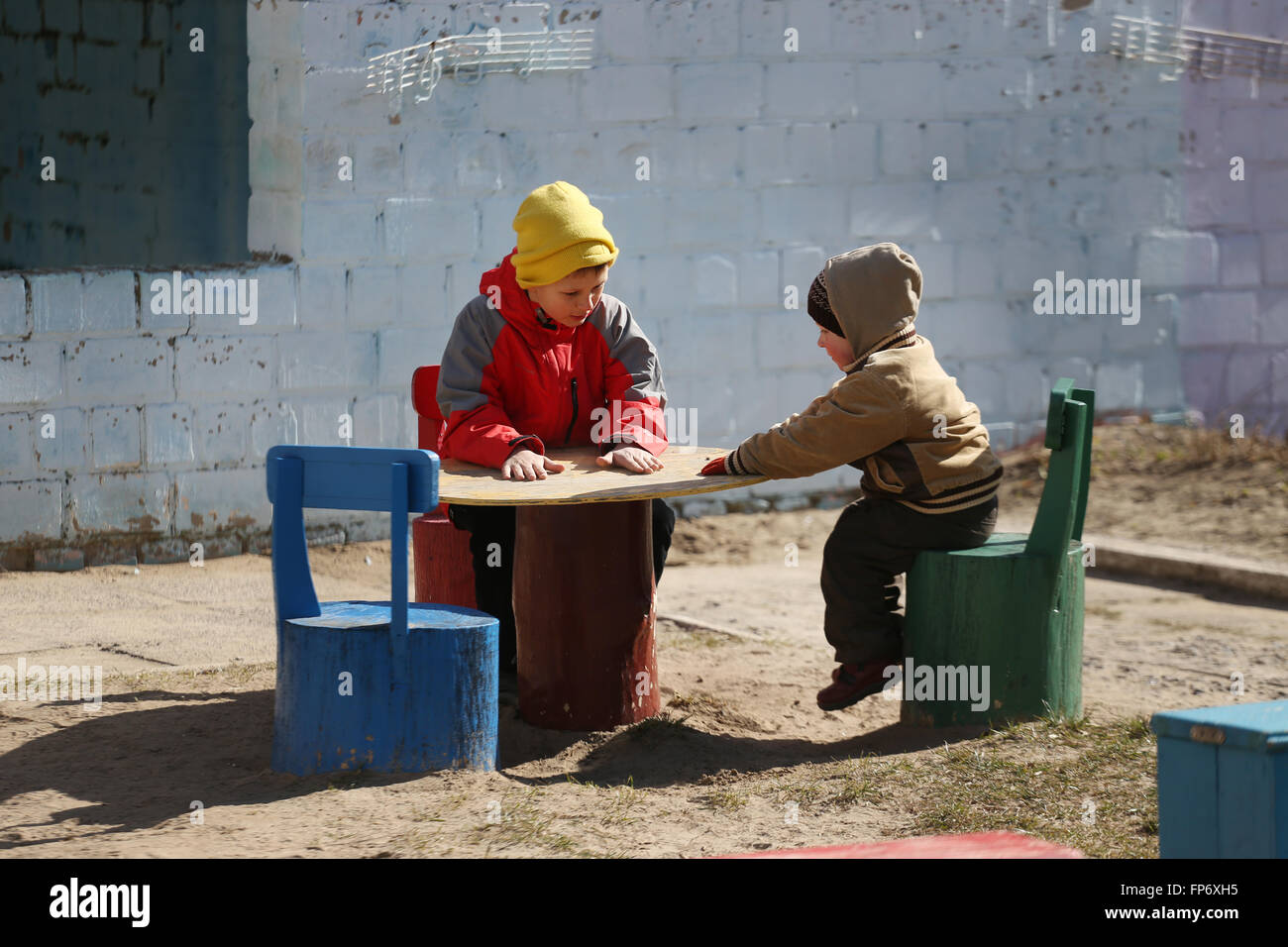 children play on the playground. early spring Stock Photo