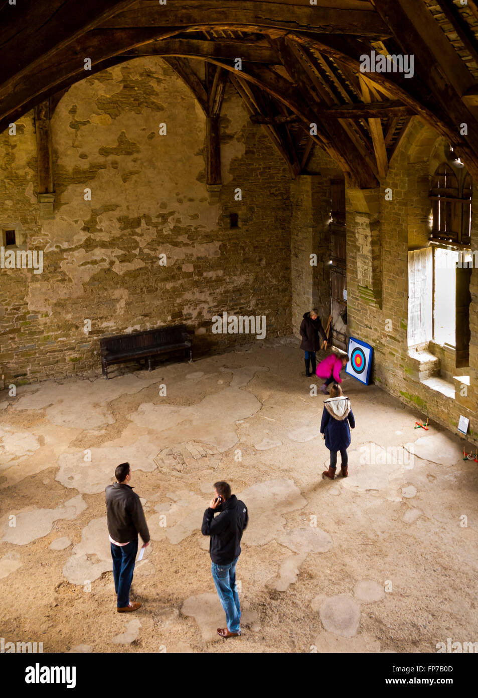 Visitors inside the medieval hall at Stokesay Castle near Ludlow in Shropshire England UK Stock Photo