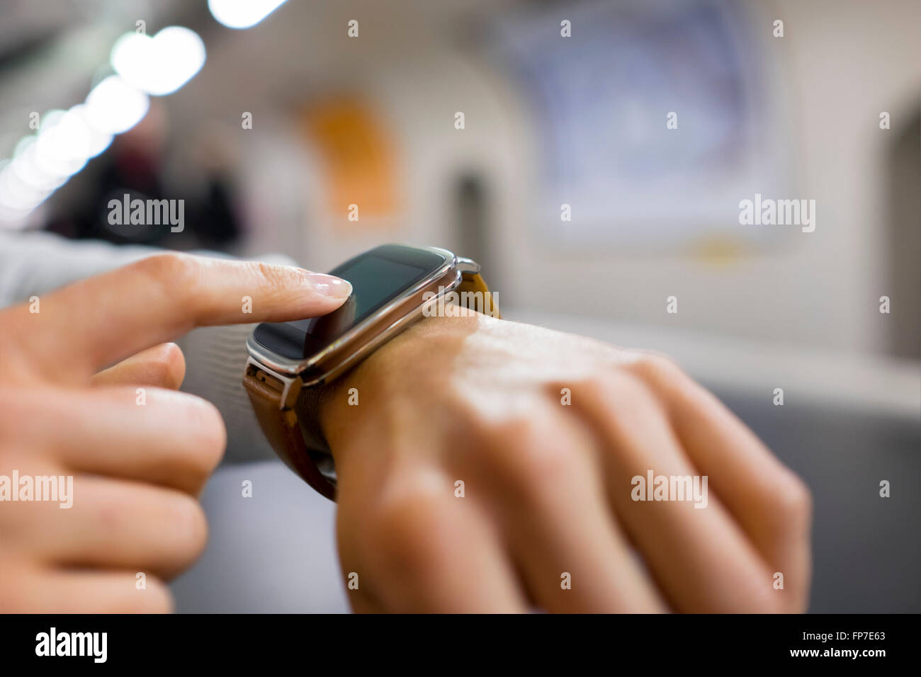 Woman using app mobile phone on platform subway station. App,sms,message,mail, connection Stock Photo
