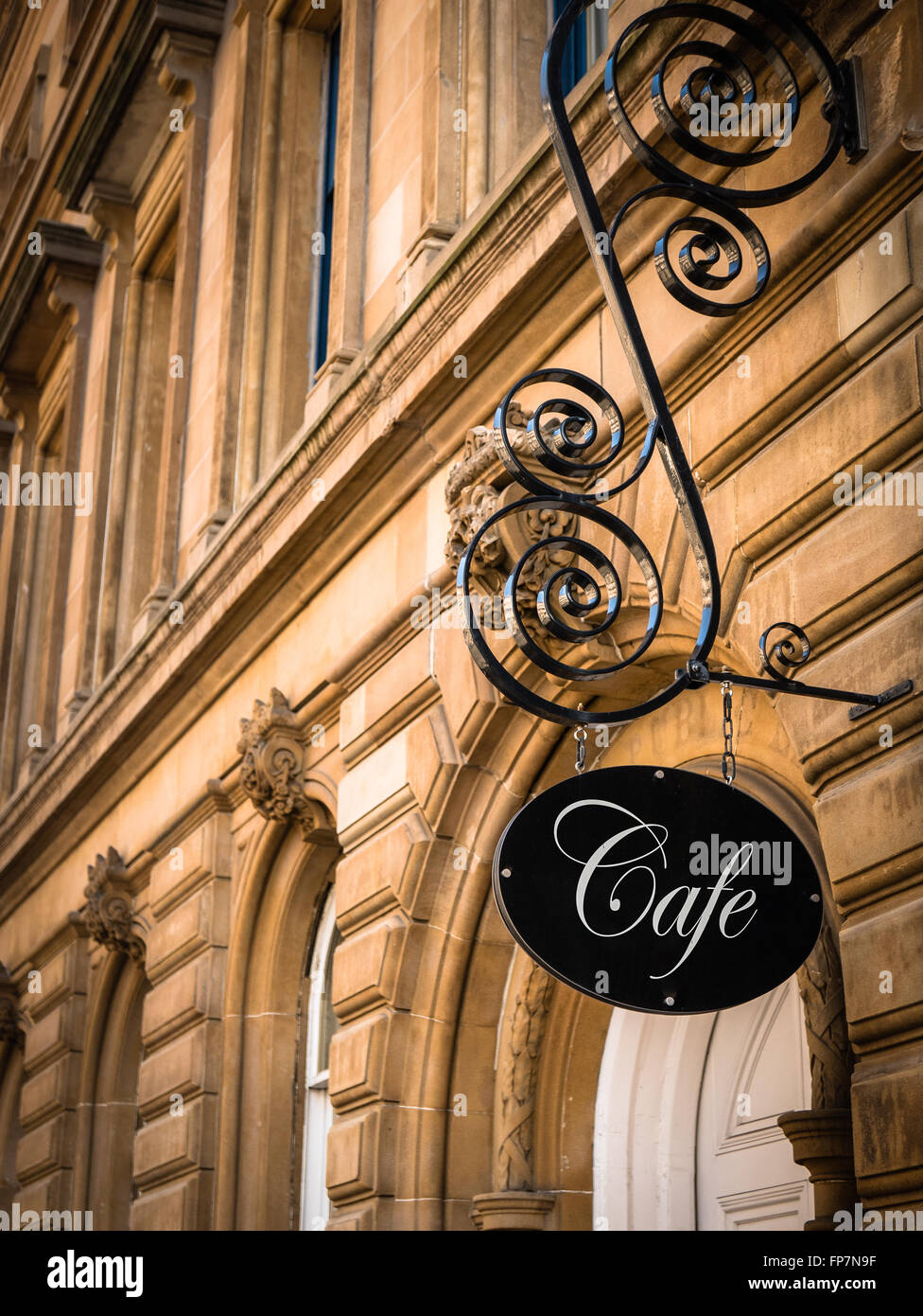 Ornate Sign For An Exclusive Cafe In A European City Stock Photo