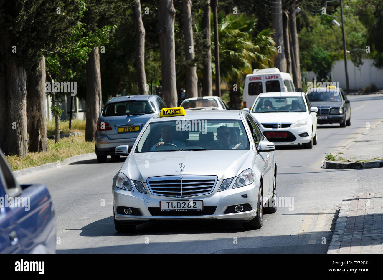 Mercedes taxi driving along a road in the city of Kyrenia, Northern Cyprus. Stock Photo