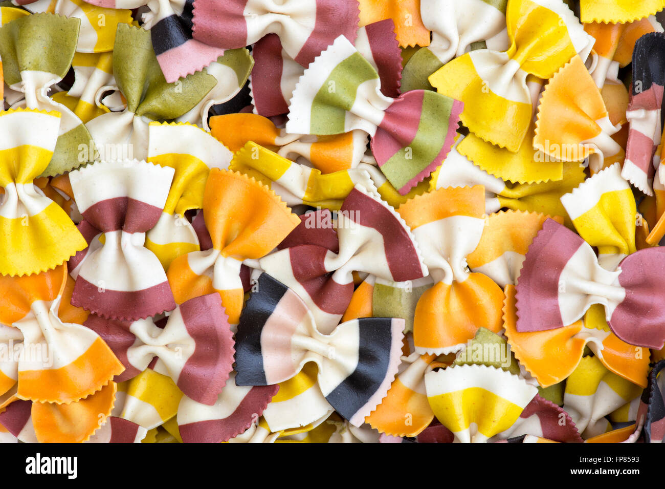 Butterfly Fantasia Multiflavours. Farfalle pasta. Flavored coloured Pasta. Specialty pasta Stock Photo