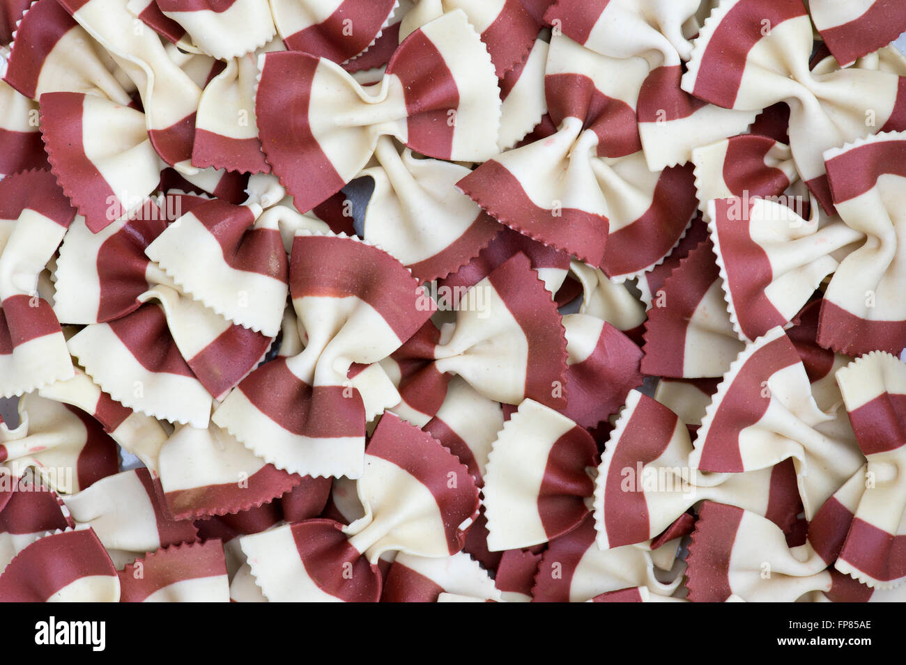 Butterfly Fantasia Red & White. Farfalle pasta. Flavored coloured Pasta. Specialty pasta Stock Photo