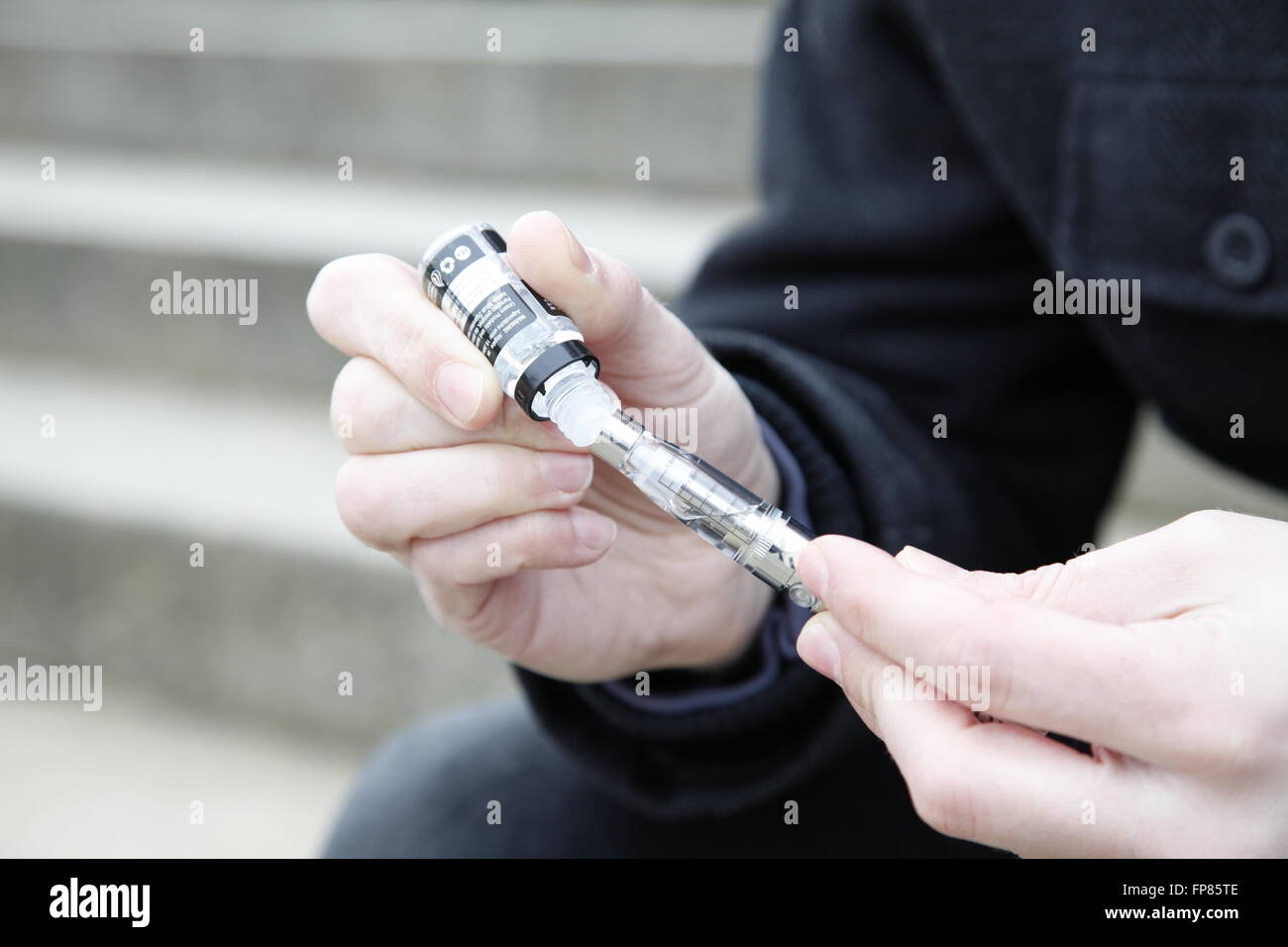 Fill up an e-cigarette Stock Photo