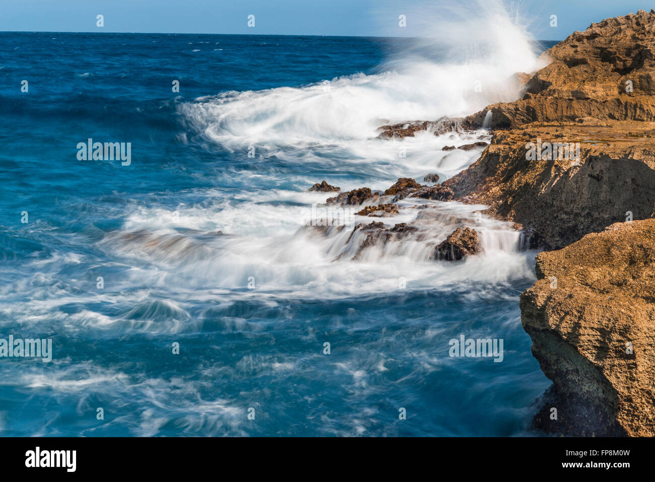 Crashing waves over the rocks on the Island of Eleuthera, Bahamas Stock Photo