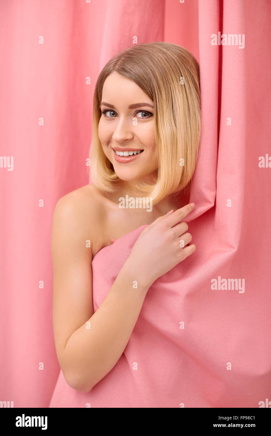 Pleasant woman standing in the fitting room Stock Photo