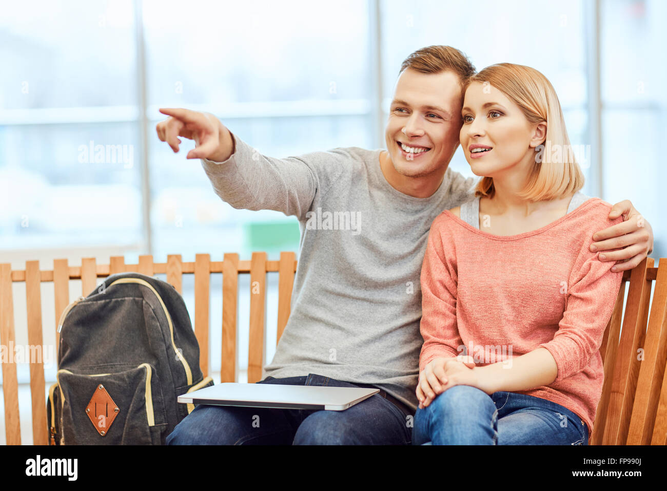 Pleasant students sitting on the bench Stock Photo