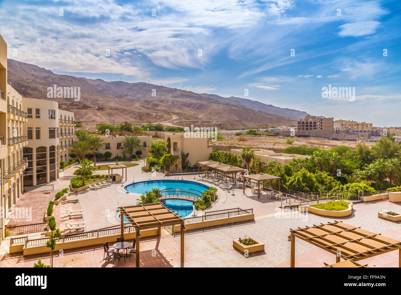 Hotel swimming pool with views of the desert rocks Stock Photo