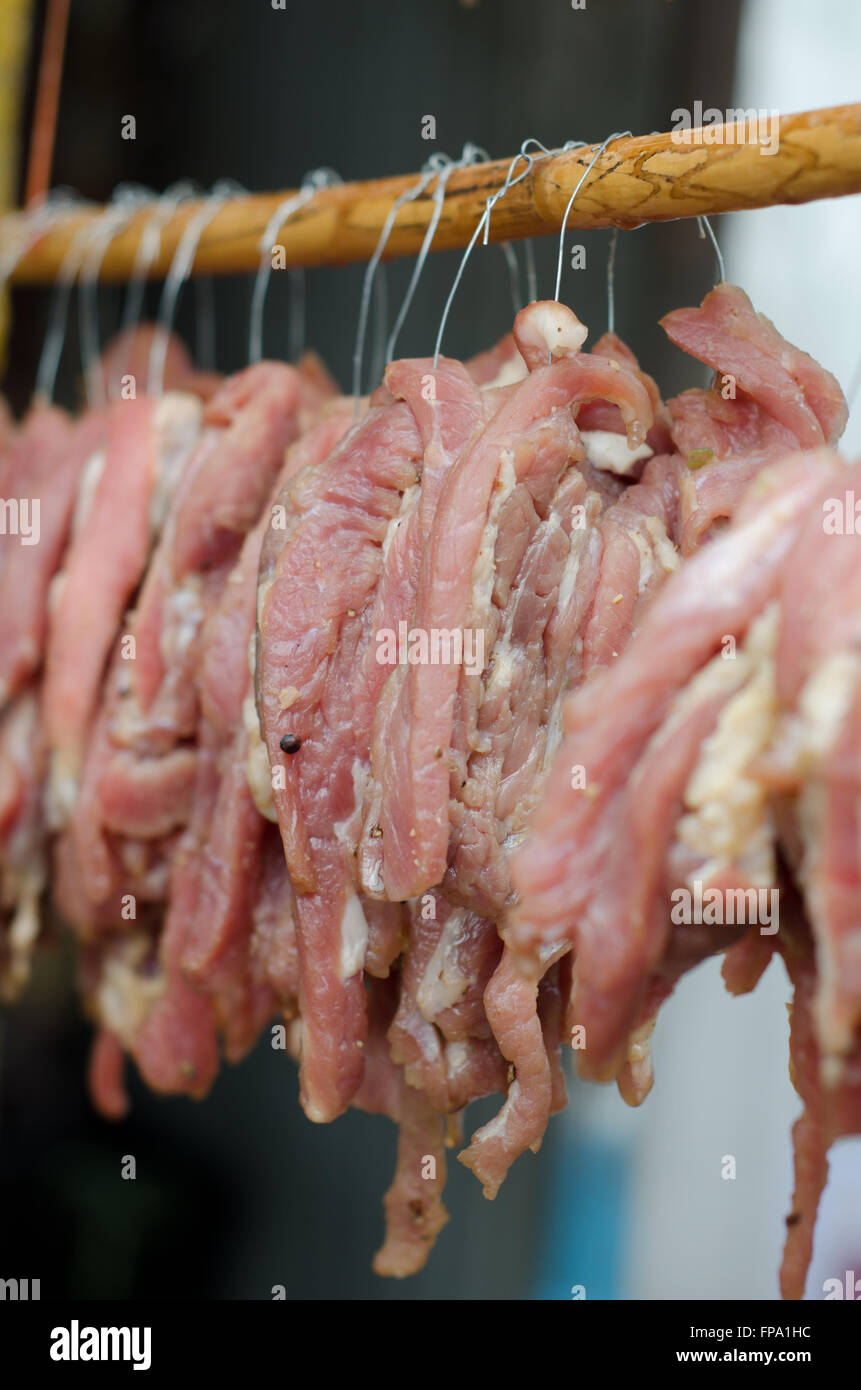 Sun dried beef on the wooden row Stock Photo