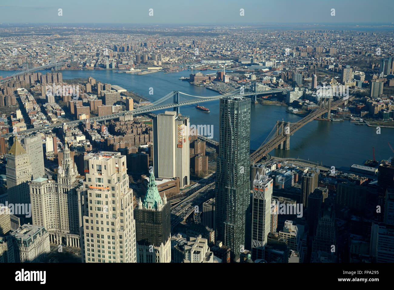 Aerial view of Lower Manhattan with Manhattan Bridge and Brooklyn Bridge over East River and borough of Brooklyn in background Stock Photo