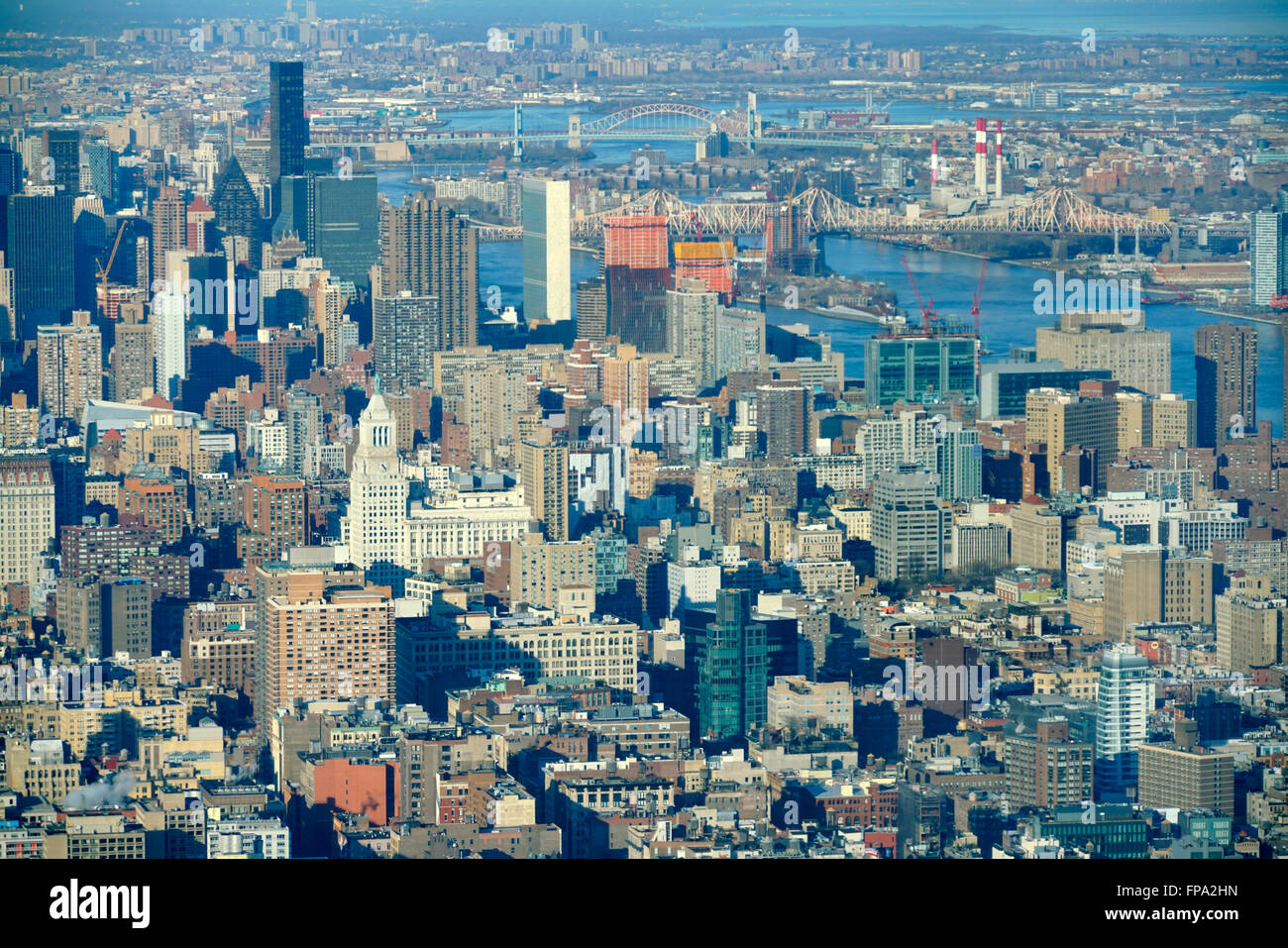 Aerial view of midtown of Manhattan with East River in the background ...