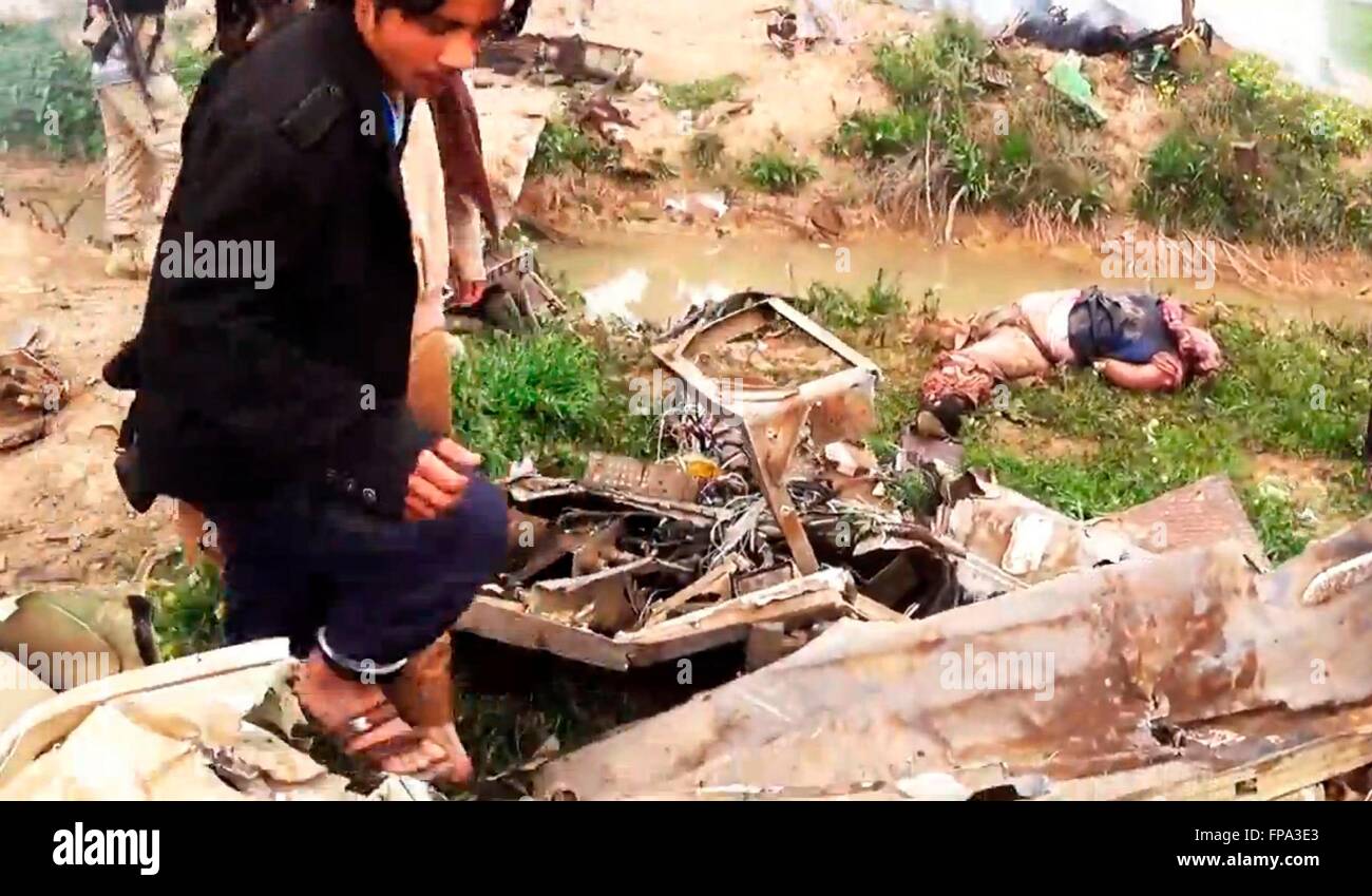 An ISIS propaganda video showing Islamic State militants around the wreckage of an Iraqi Air Force AC-208B Combat Caravan aircraft March 16, 2016 near Hawija, Kirkuk Province, Iraq. The Islamic State is claiming that they shot the plane down using an anti-aircraft missile as it was carrying out a bombing mission. Stock Photo