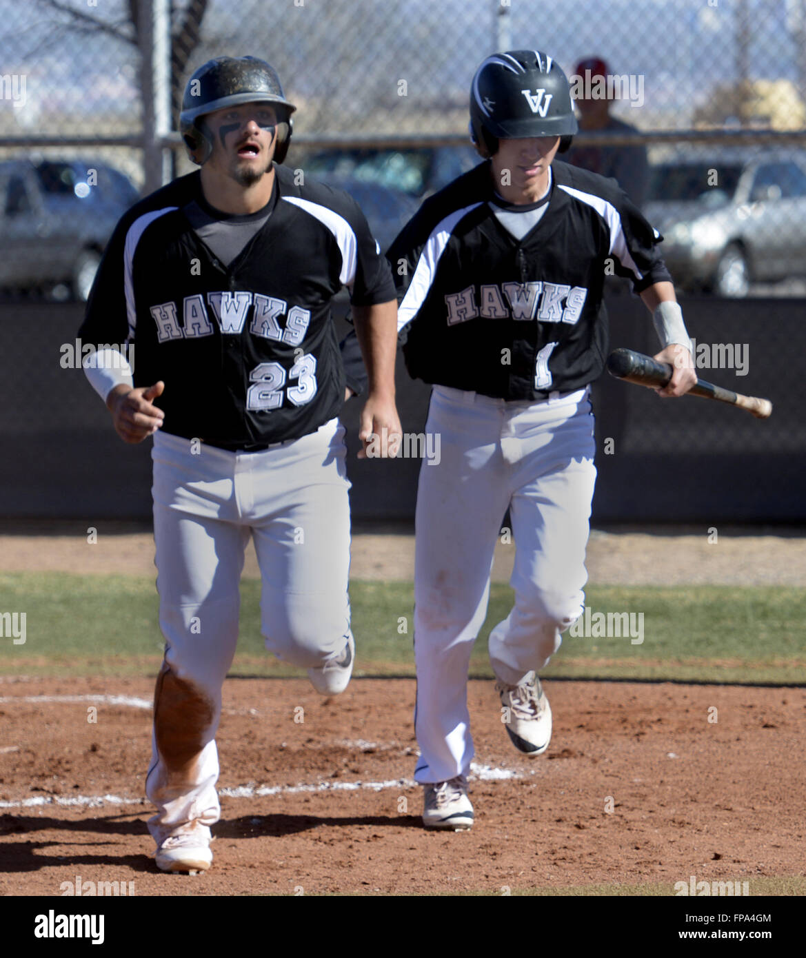 Usa. 17th Mar, 2016. SPORTS -- Volcano Vista's Dillon Rodriguez, 23, and Evan Sanchez, 1, run back to the dugout after they scored in the first inning of the game against Cleveland at Volcano Vista on Thursday, March 17, 2016. Volcano Vista won 6-5. © Greg Sorber/Albuquerque Journal/ZUMA Wire/Alamy Live News Stock Photo