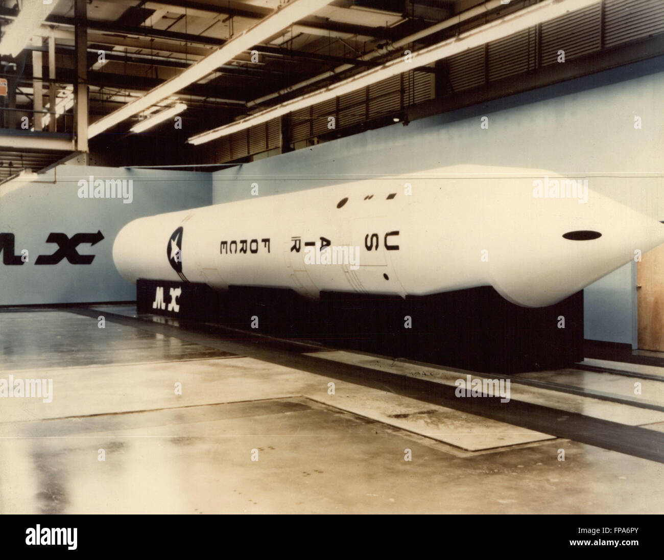 1989 - Miss/Rocks-MX Mockup: M-X ICBM - This is a full-scale mockup of the new mobile M-X intercontinental ballistic missile (ICBM) being developed by the U.S.Air Force. Major M-X contractors include: Thiokol Corp. flags , Aerojet General Corp. (Stage 2), Hercules, Inc. (Stage 3), Rockwell International Corp. (Stage 4, flight computer, guidance and control system integrator) and Martin-Marietta Corp. (Assembly, Test and Systems Support). First M-X flight test will be in 1983 with initial operational capability (ten missiles) in 1986 and full operational capability (200 missiles) in 1989. (Cre Stock Photo