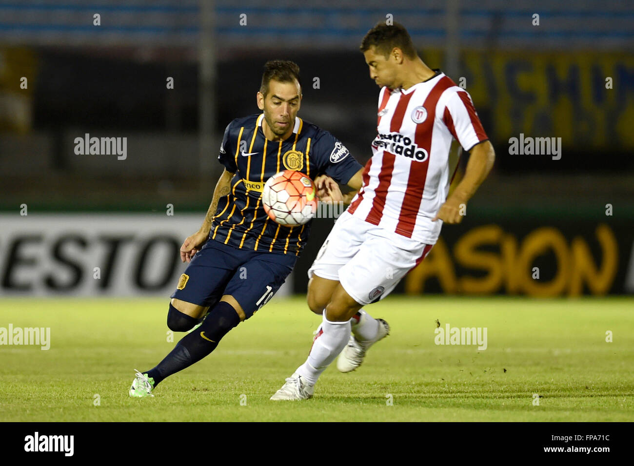 Montevideo, Uruguay. 17th Mar, 2106. Diego Rodriguez (R) of Uruguay's River Plate vies for the ball with Cesar Fabian Delgado (L) of Argentina's Rosario Central, during the Group 2 match of the Libertadores Cup, held at Centenario Stadium in Montevideo, capital of Uruguay, on March 17, 2106. Rosario Central won by 3-1. © Nicolas Celaya/Xinhua/Alamy Live News Stock Photo
