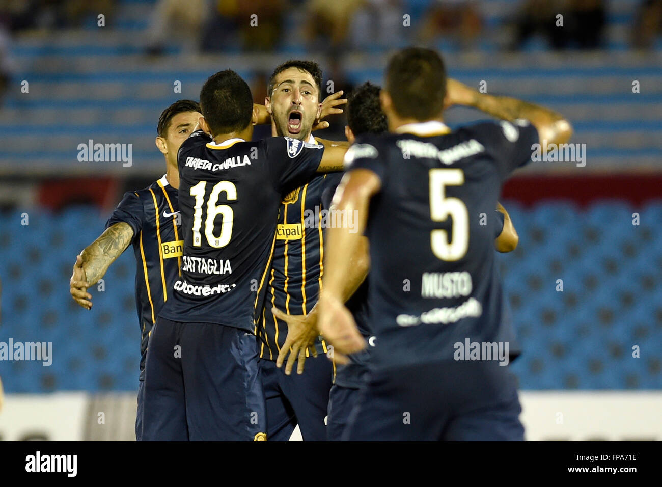 Montevideo, Uruguay. 17th Mar, 2106. Players of Argentina's Rosario Central celebrate a score during the Group 2 match of the Libertadores Cup, against Uruguay's River Plate, held at Centenario Stadium in Montevideo, capital of Uruguay, on March 17, 2106. Rosario Central won by 3-1. © Nicolas Celaya/Xinhua/Alamy Live News Stock Photo