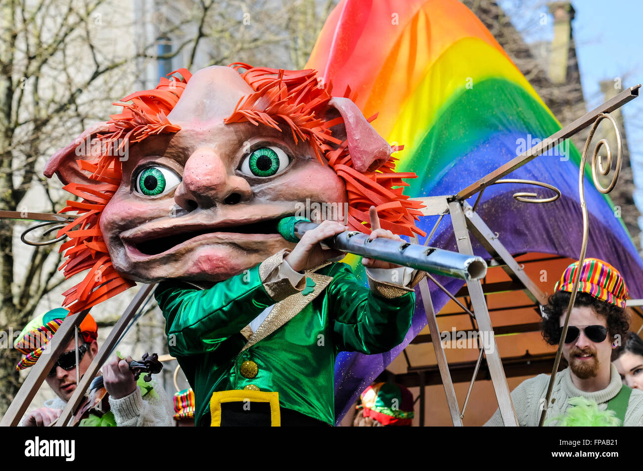 Belfast, Northern Ireland, UK. 17th March, 2016. A leprachaun plays a tin whistle at the annual Saint Patrick's Parade. Credit:  Stephen Barnes/Alamy Live News Stock Photo