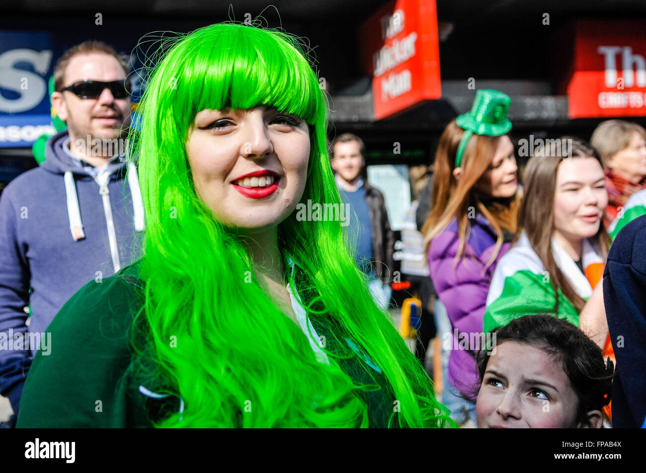 Belfast, Northern Ireland, UK. 17th March, 2016. A young woman wears a green wig at the annual Saint Patrick's Parade. Credit:  Stephen Barnes/Alamy Live News Stock Photo