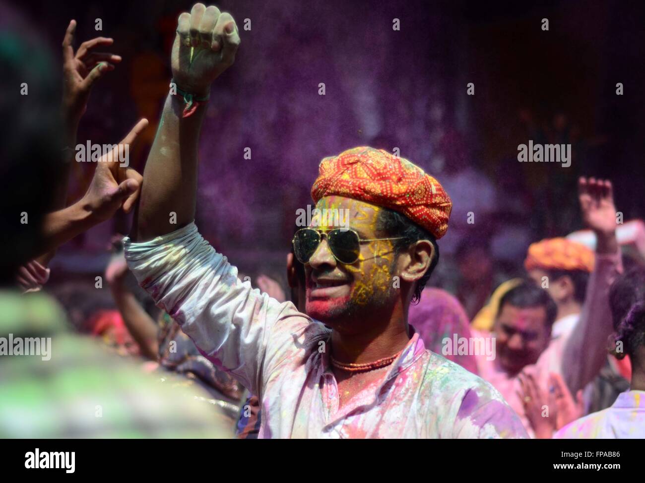 Mathura, Uttar Pradesh, India. 18th Mar, 2016. Mathura: Devotee dance during Lathmar holi festival celebration at Nandgaon in Mathura on 18-03-2016. Lath mar Holi is a local celebration of the Hindu festival of Holi. It takes place days before the actual Holi in the neighbouring towns of Barsana and Nandgaon near Mathura in the state of Uttar Pradesh, where thousands of Hindus and tourists congregate, each year, The name means ''that Holi in which [people] hit with sticks' Credit:  Prabhat Kumar Verma/ZUMA Wire/Alamy Live News Stock Photo