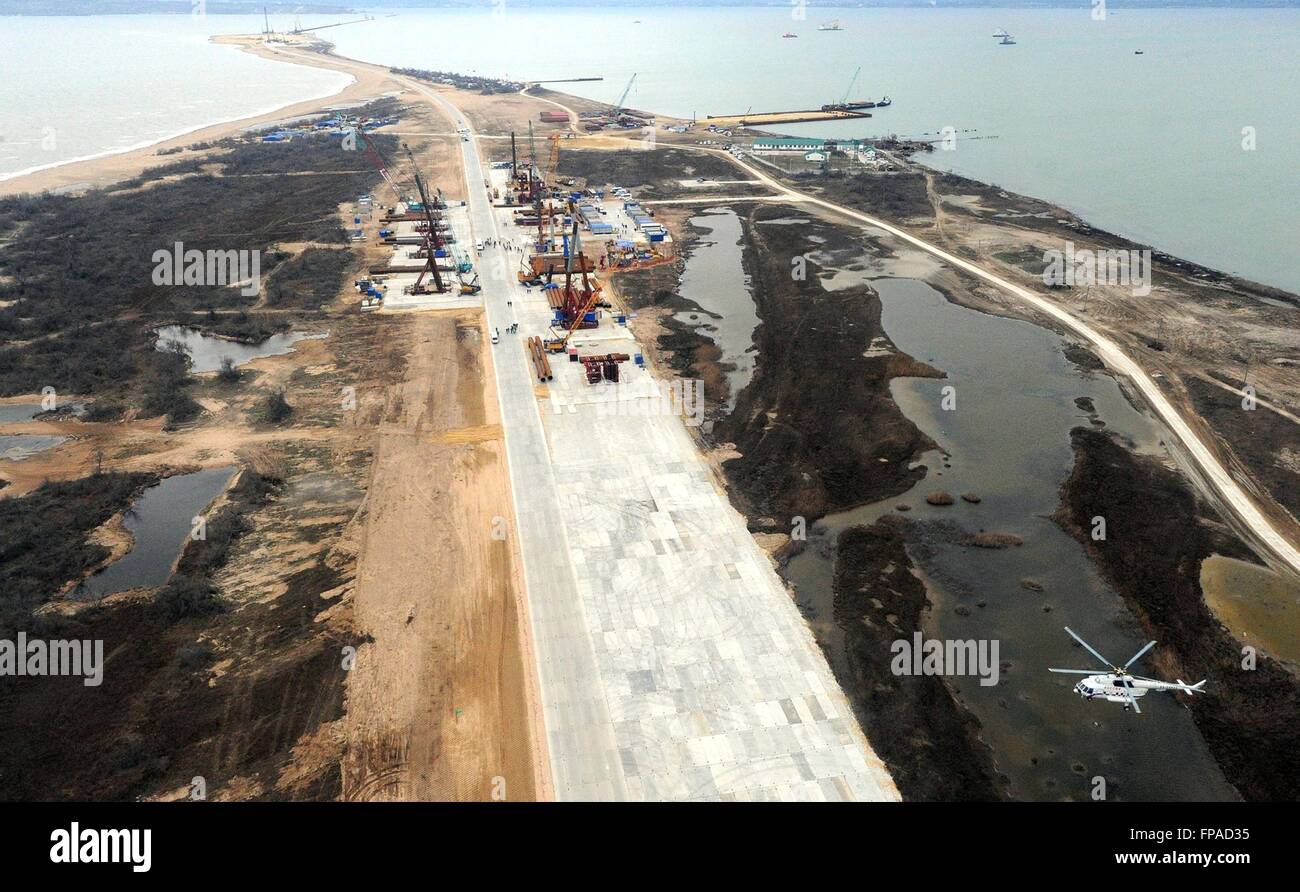 Crimea, Russia. 18th Mar, 2016. Aerial view of the construction progress on the bridge spanning the Kerch Strait March 18, 2016 in Crimea. The bridge will link mainland Russia to Crimea annexed by Putin two-years ago today. Credit:  Planetpix/Alamy Live News Stock Photo