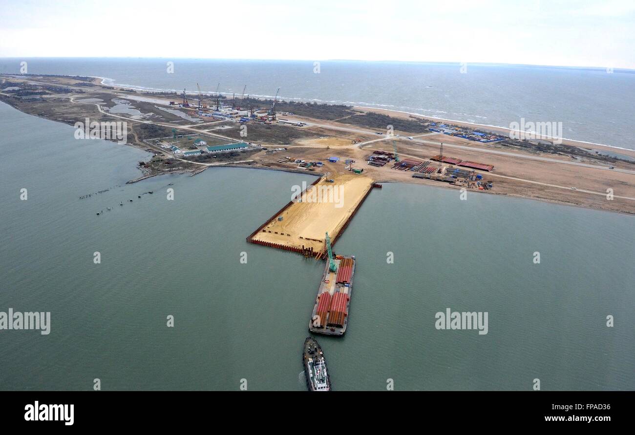 Crimea, Russia. 18th Mar, 2016. Aerial view of the construction progress on the bridge spanning the Kerch Strait March 18, 2016 in Crimea. The bridge will link mainland Russia to Crimea annexed by Putin two-years ago today. Credit:  Planetpix/Alamy Live News Stock Photo