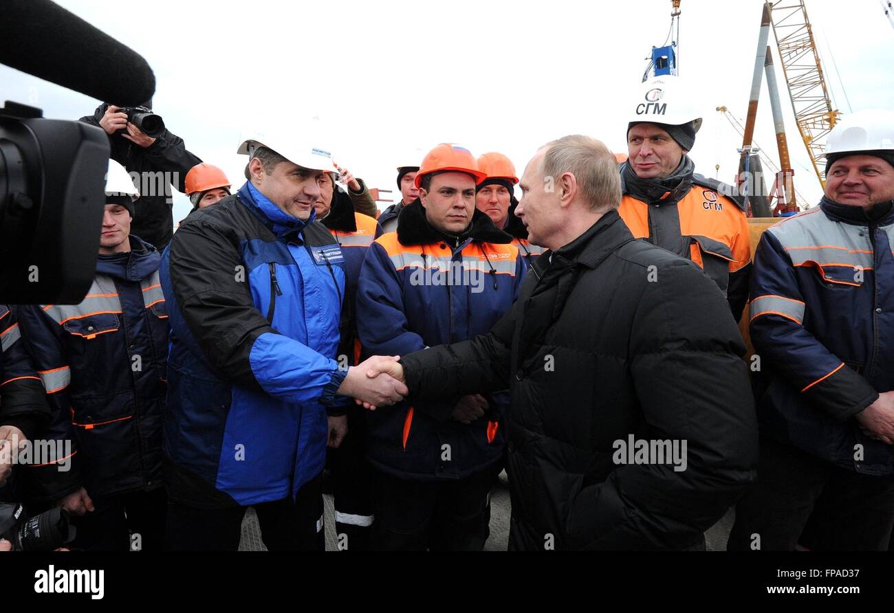 Crimea, Russia. 18th Mar, 2016. Russian President Vladimir Putin greats workers building the bridge spanning the Kerch Strait March 18, 2016 in Crimea. The bridge will link mainland Russia to Crimea annexed by Putin two-years ago today. Credit:  Planetpix/Alamy Live News Stock Photo