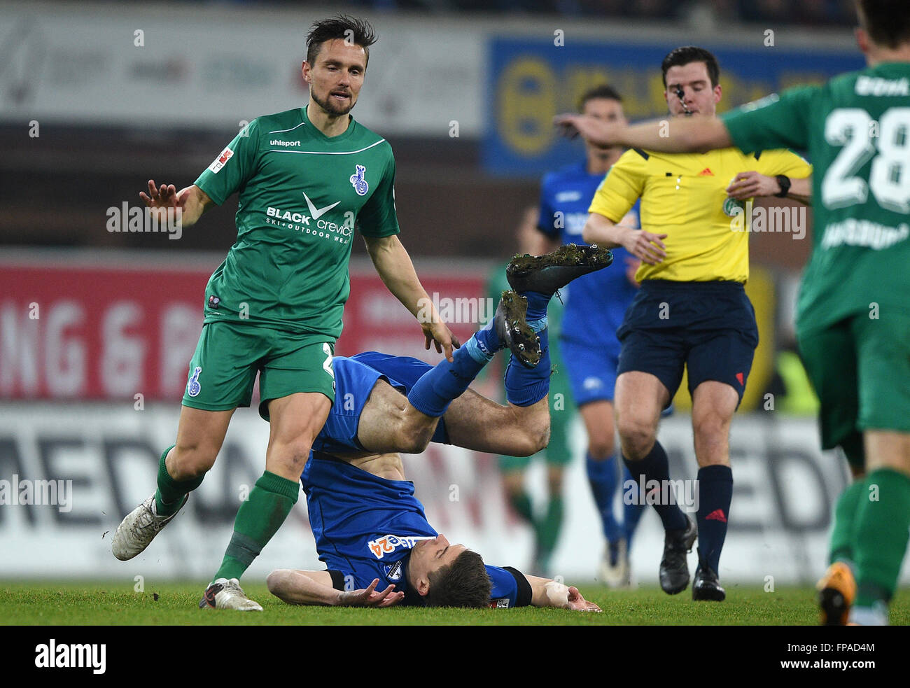 Paderborn, Germany. 18th Mar, 2016. Duisburg's James Holland (l) and Paderborn's Nicklas Helenius in action during the German 2nd Bundesliga soccer match between SC Paderborn 07 and MSV Duisburg at Benteler-Arena in Paderborn, Germany, 18 March 2016. PHOTO: JONAS GUETTLER/dpa (EMBARGO CONDITIONS - ATTENTION: Due to the accreditation guidlines, the DFL only permits the publication and utilisation of up to 15 pictures per match on the internet and in online media during the match.) © dpa/Alamy Live News Stock Photo