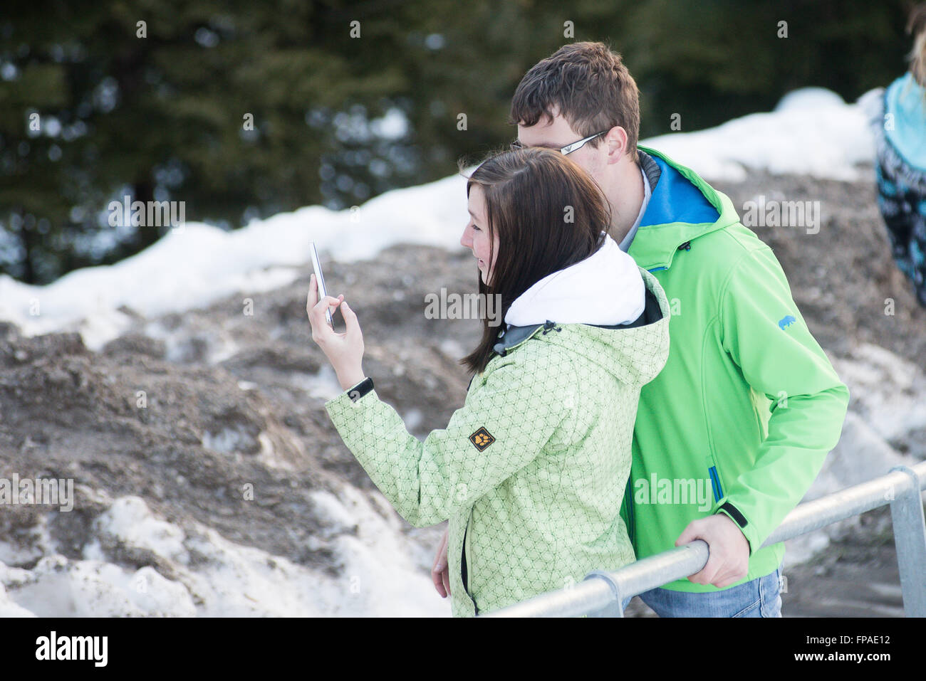 Planica, Slovenia. 18th Mar, 2016. Couple taking selfies at the FIS Ski Jumping World Cup finals in Planica, Slovenia on March 18, 2016. © Rok Rakun/Pacific Press/Alamy Live News Stock Photo