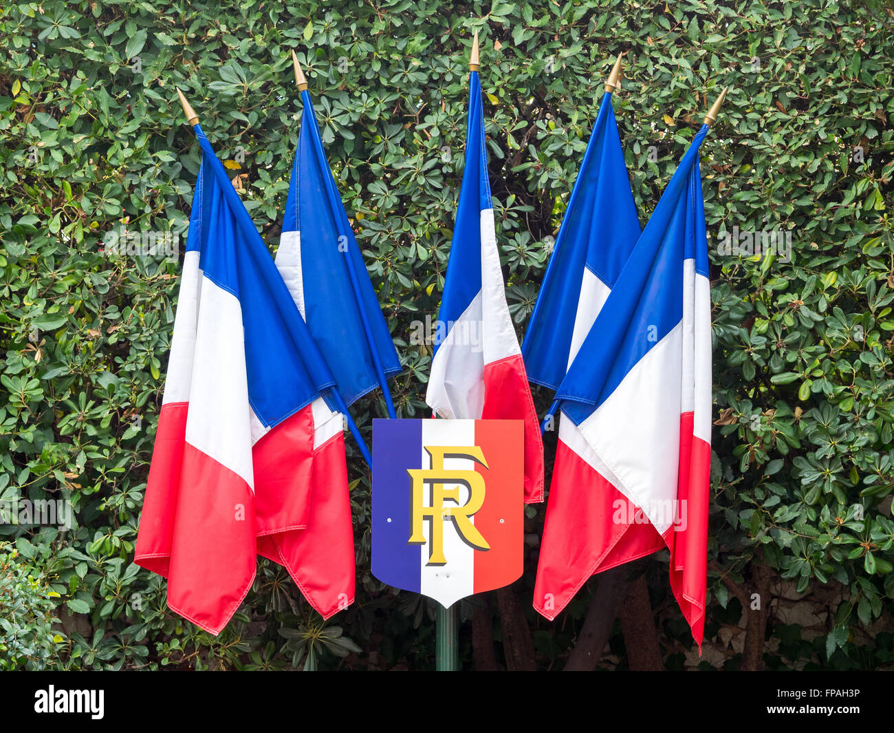 5 French flags fixed to a pole with the arms of Republic of France, during the national celebrations on the 14th of July. Stock Photo