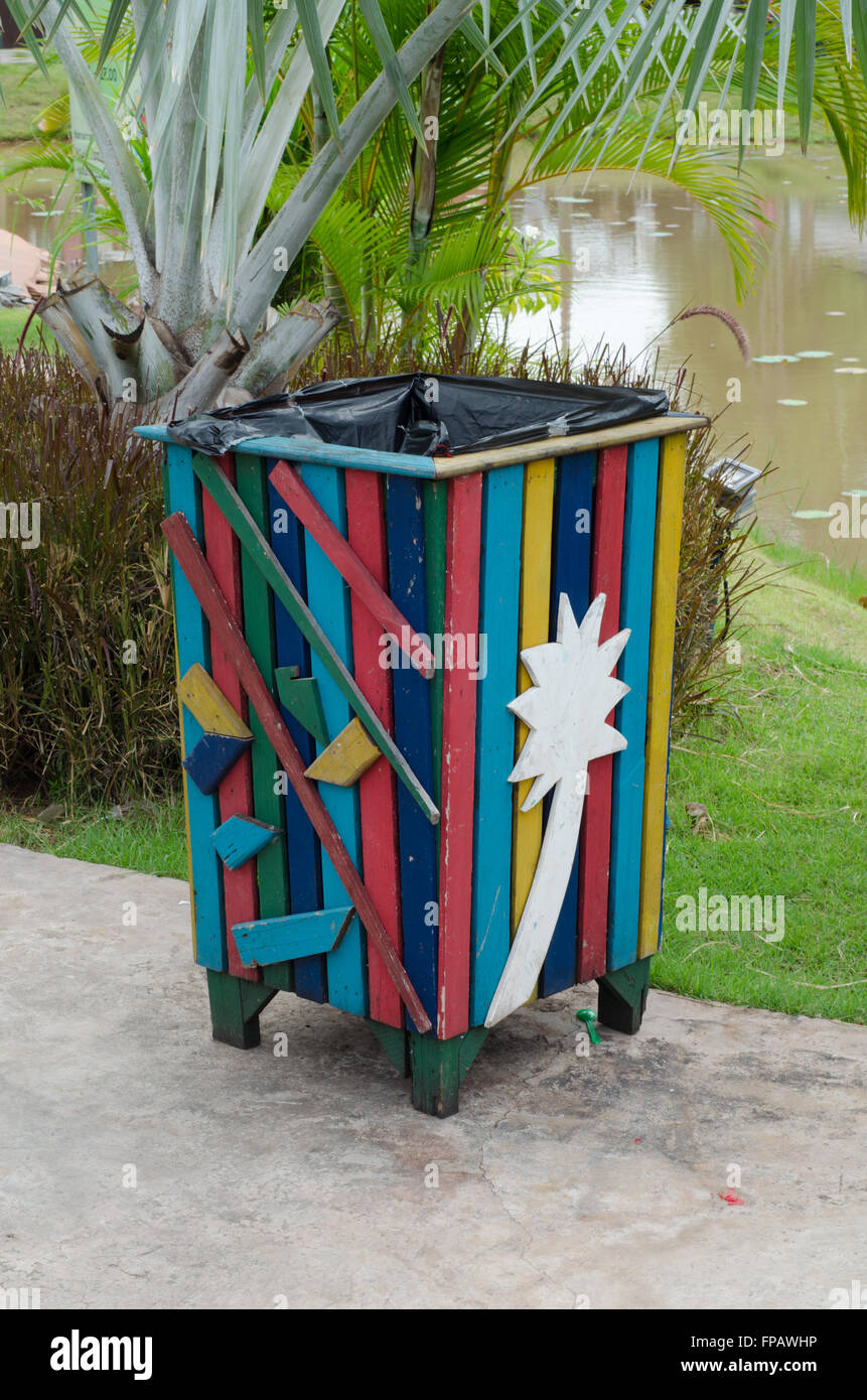 Colorful bin in the park. Trash container Stock Photo