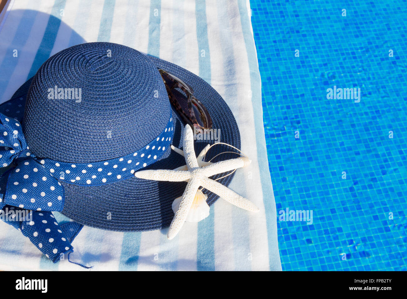 towel and bathing accessories near pool Stock Photo Alamy