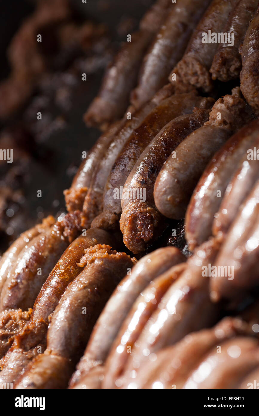 Hillside Brewery, Gloucestershire, craft ale brewery. Sausage and beer day. Sausages grilled over the coals. Stock Photo