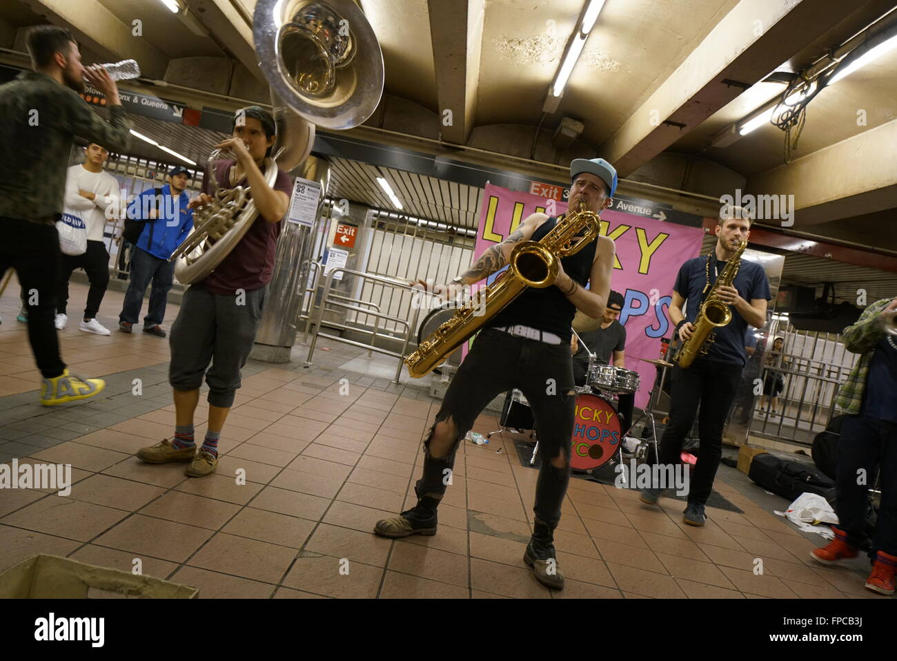 A brass band performing in 34th street Herald Square subway station