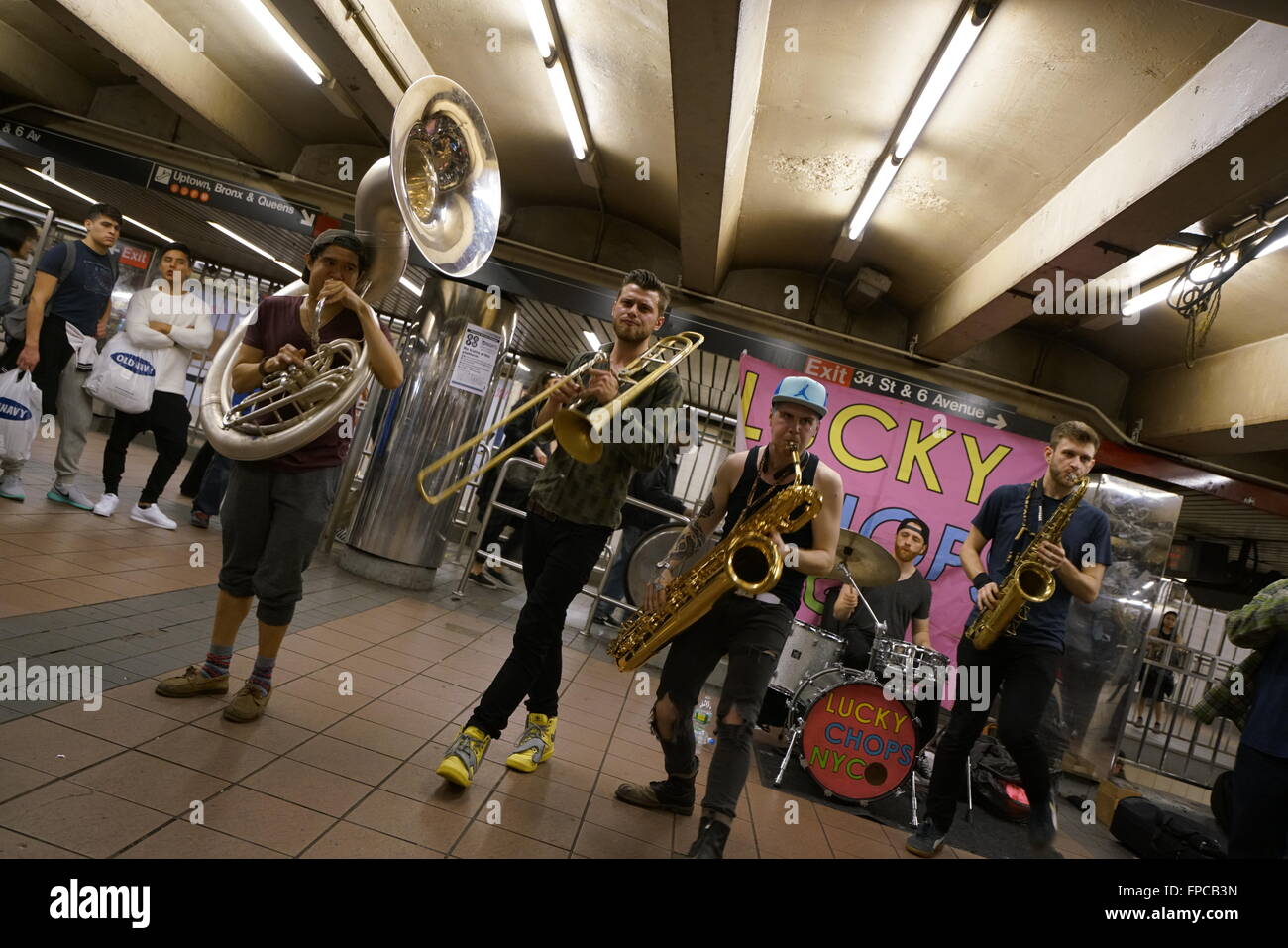 A brass band performing in 34th street Herald Square subway station