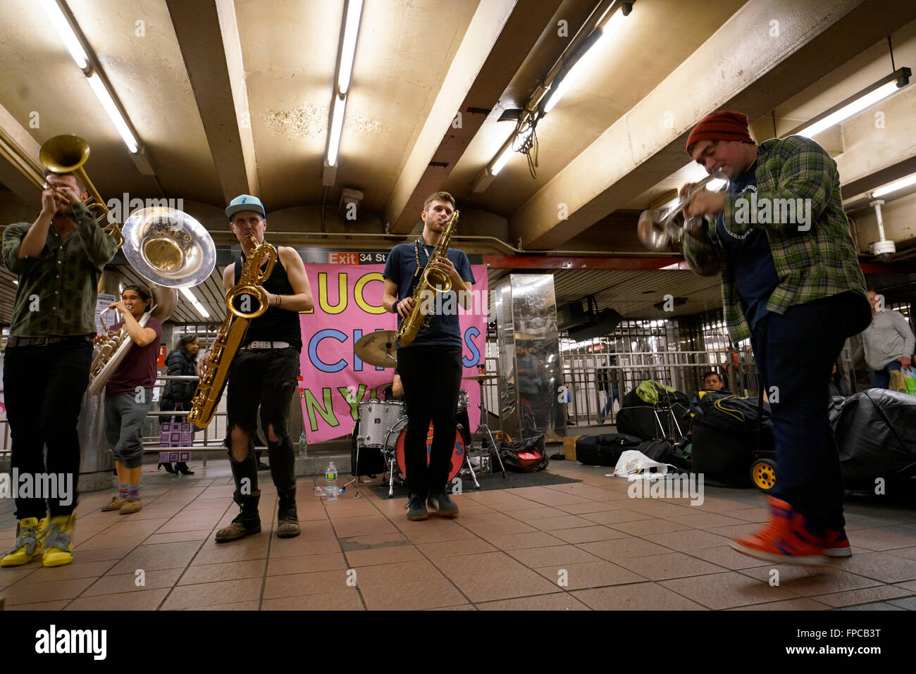 A brass band performing in 34th street Herald Square subway station