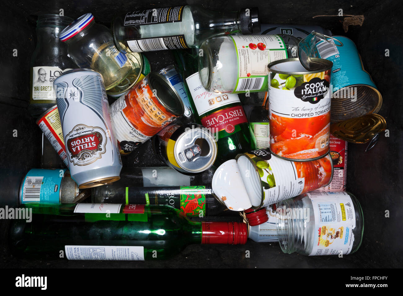 Detail of a roadside recycling box with cans, glass, bottles and tins