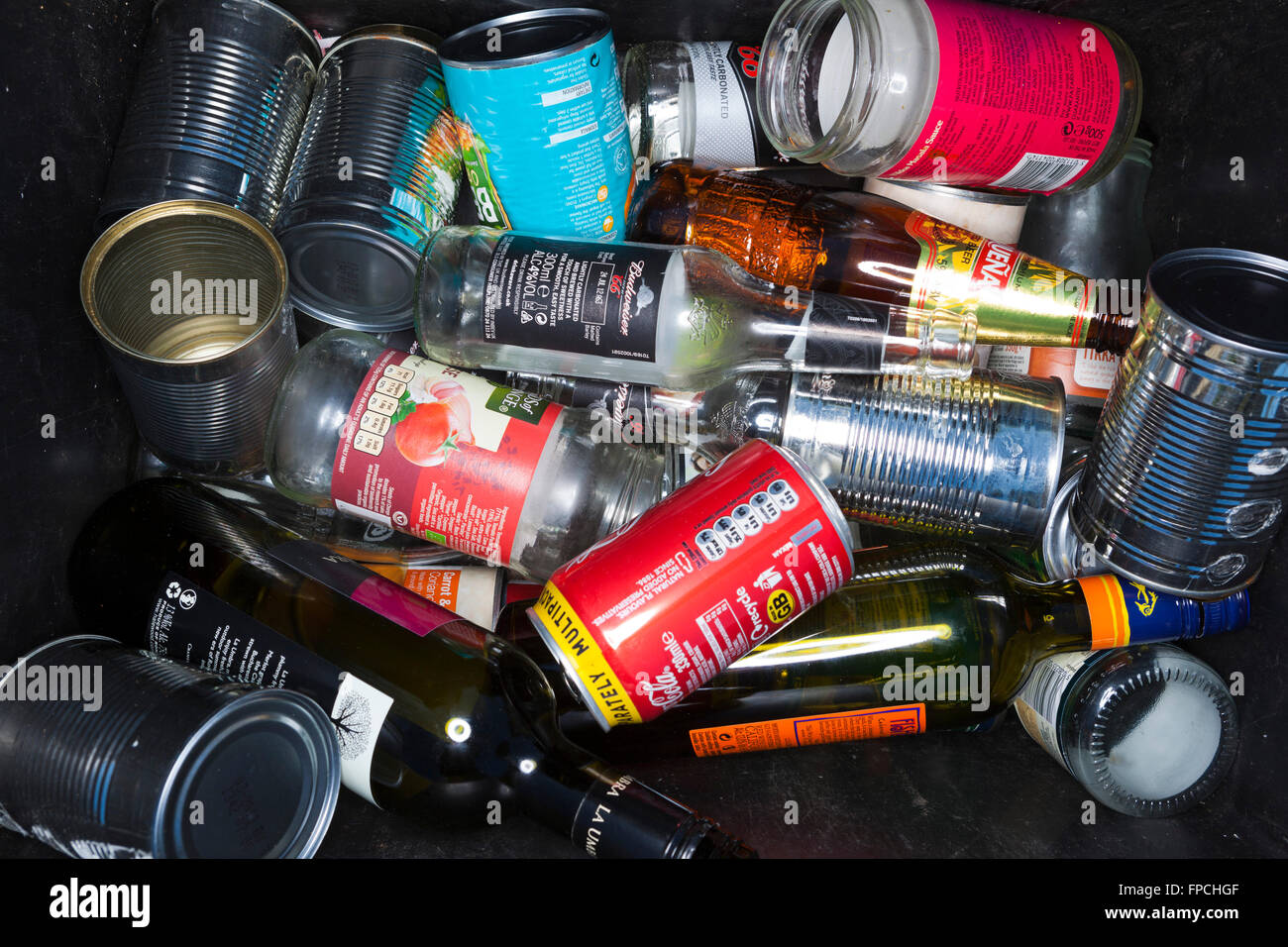 Detail of a roadside recycling box with cans, glass, bottles and tins