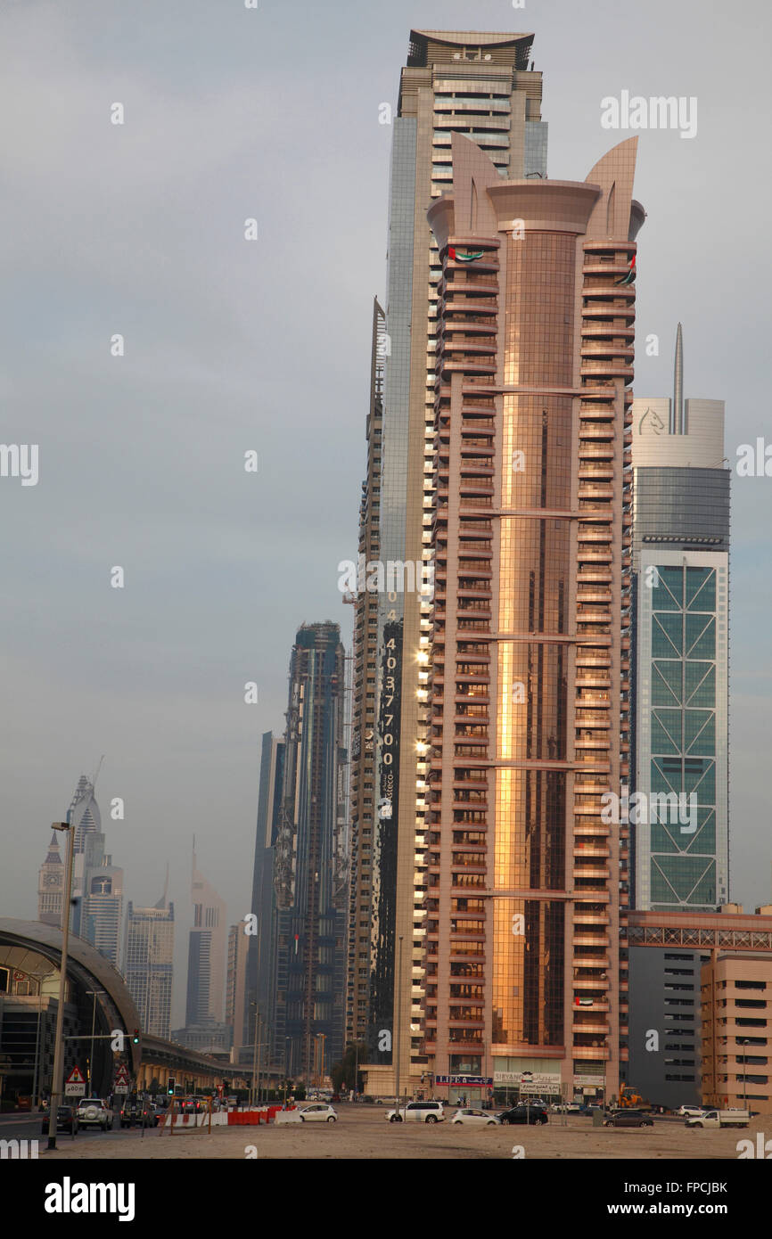 An exterior view of a bronze tinted glass tower in Dubai. Designed by SOM. Stock Photo