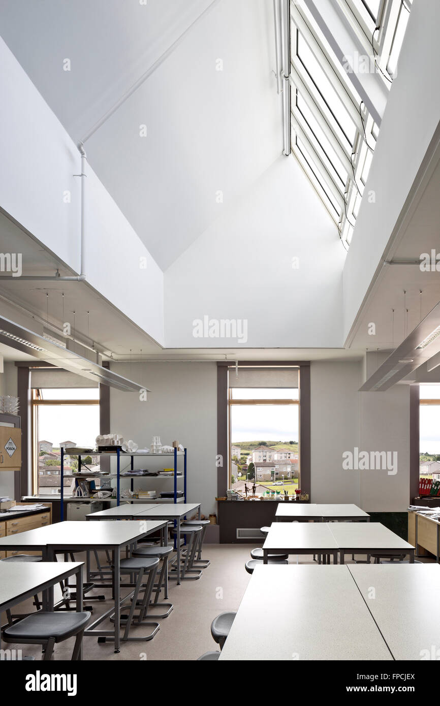 A classroom inside Port Glasgow Shared Campus school, with empty desks and stools. Stock Photo