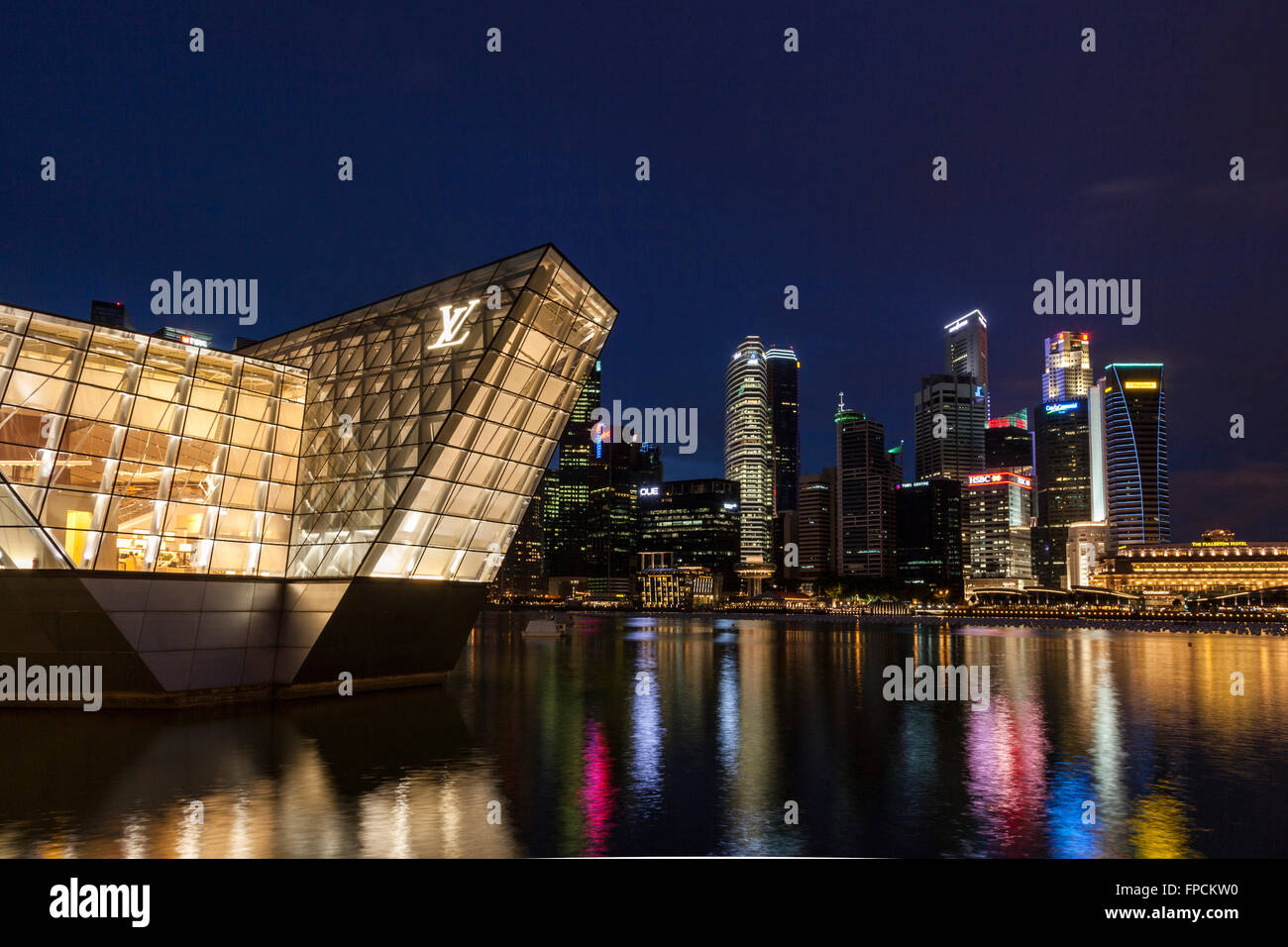 A view of the Louis Vuitton Island Maison in Singapore, the building is lit up at night time. Stock Photo