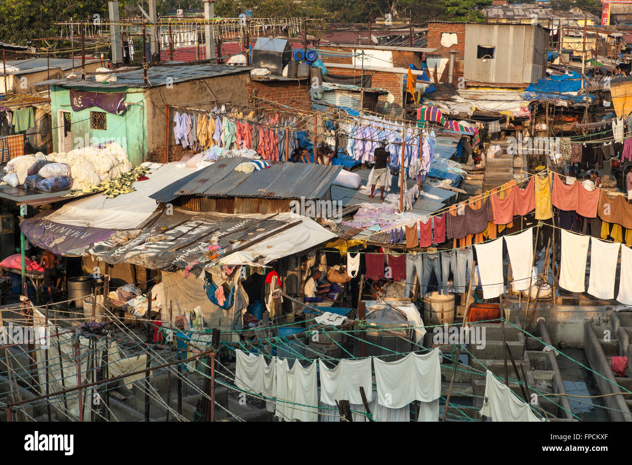 A View of the city of Mumbai, showing the poverty and poor housing and the Mahalaxmi Dhobi Ghat, open air laundromat. Stock Photo