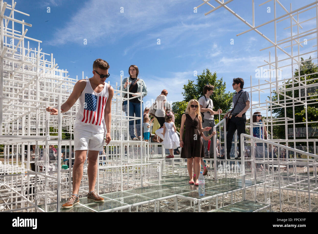 A modern structure, people are exploring the strange structure. Stock Photo