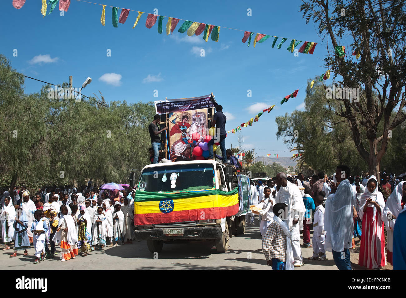 Procession during the Timkat festival. A board depicting Saint George is visible in the truck ( Ethiopia) Stock Photo