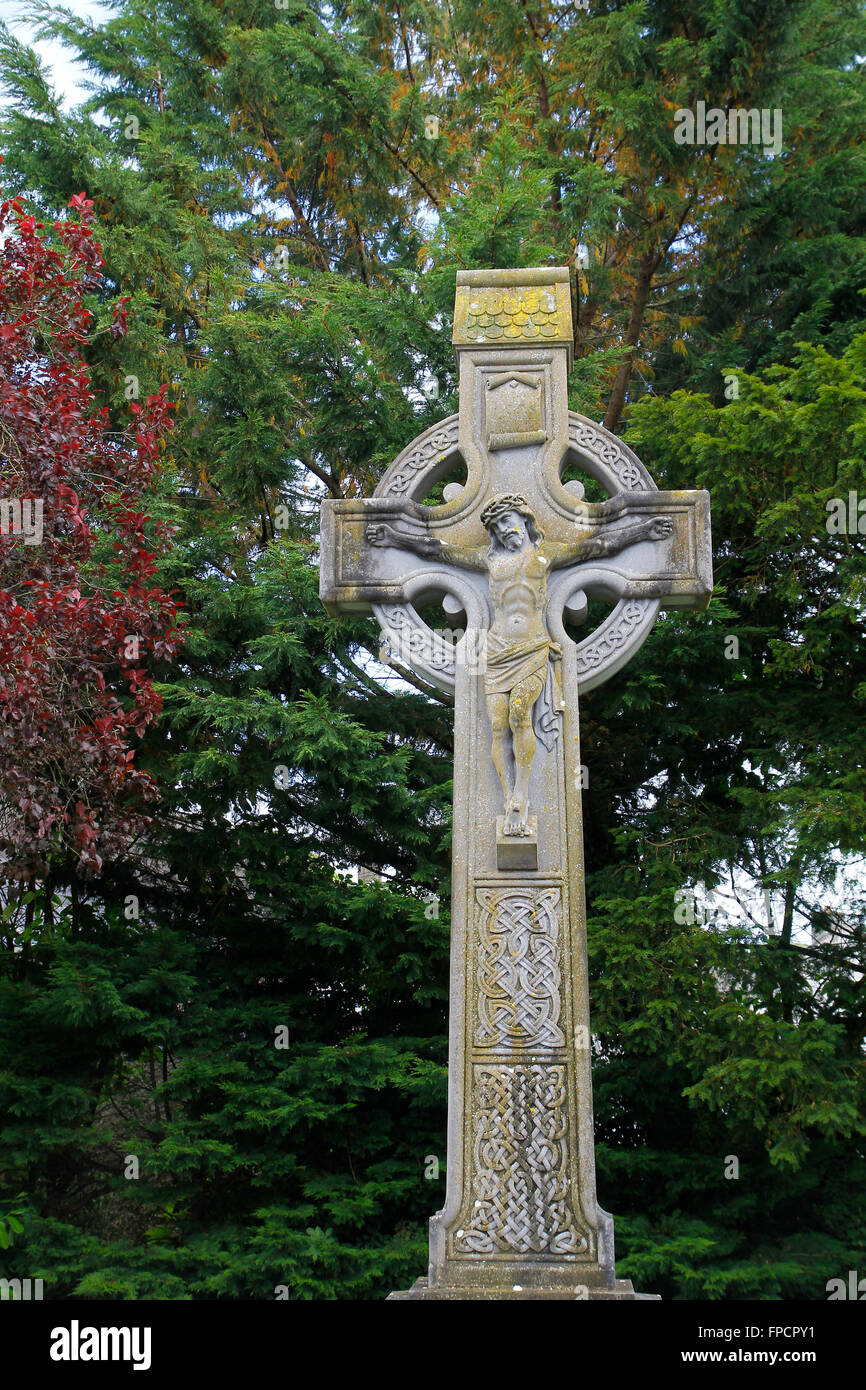 Celtic cross in Ireland, with christ crucified Stock Photo Alamy