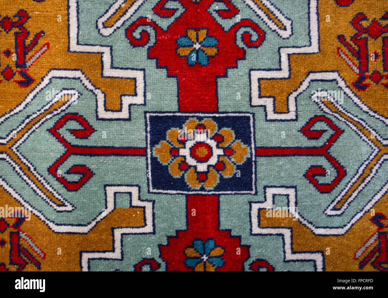 Armenian colorful hand made rug with traditional patterns and ornaments