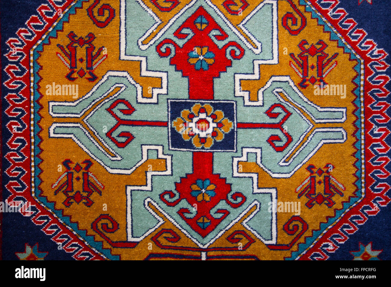 Armenian colorful hand made rug with traditional patterns and ornaments